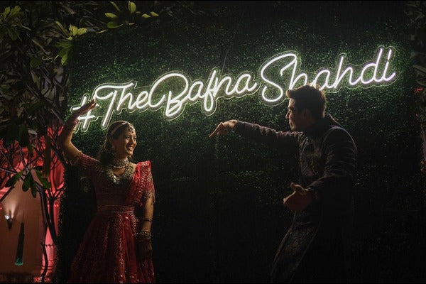 Couple dancing infront of neon wedding lights - Neon Attack